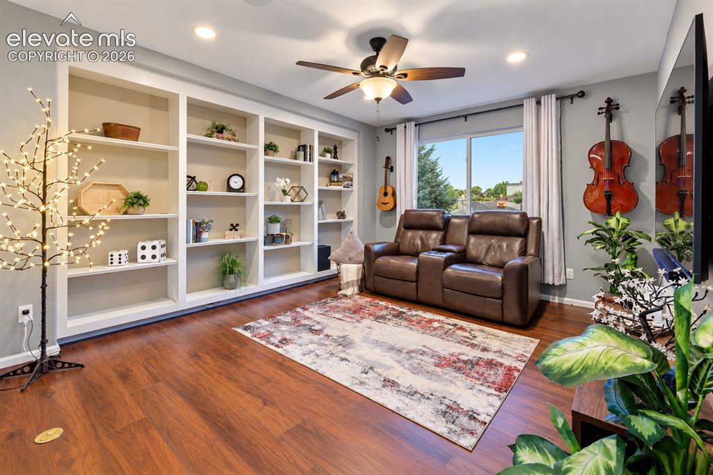Image 14 of 50: A spacious upper-level retreat creates another place to watch movies, play 