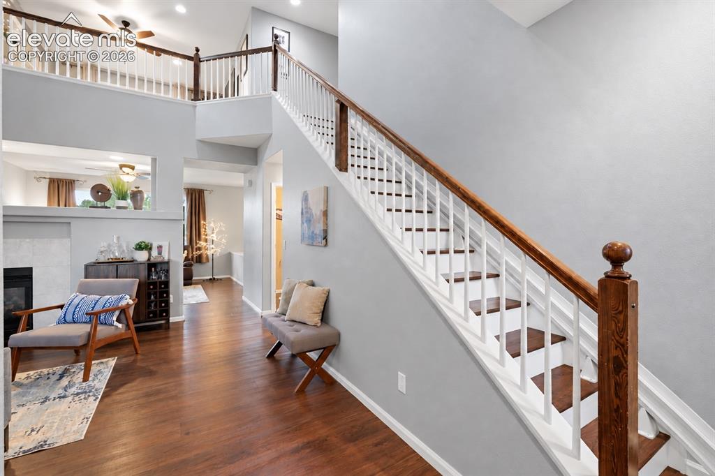 Image 17 of 50: Vaulted ceilings and the open staircase give the home an airy sense of spac