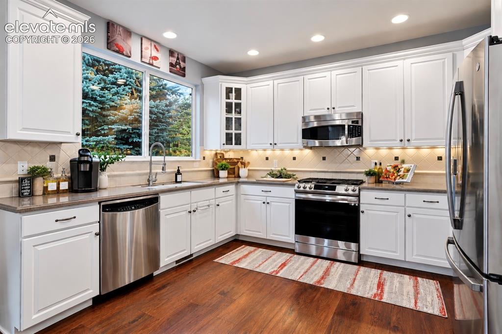 Image 4 of 50: Bright cabinetry, stainless appliances and generous workspace make this kit