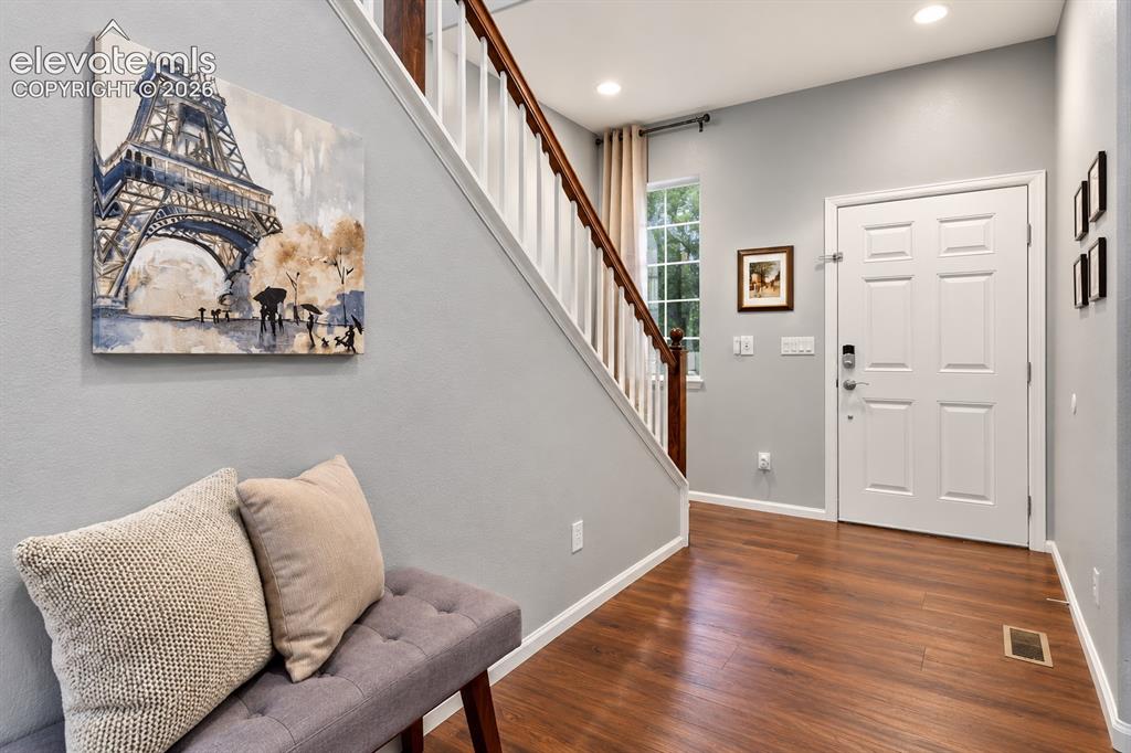Image 40 of 50: A bright, open foyer welcomes you home with soaring ceilings and an easy fl