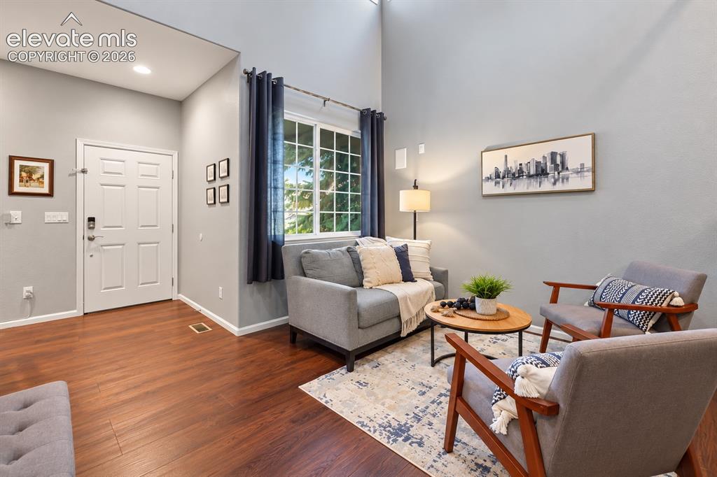 Image 41 of 50: The welcoming front entry flows naturally into a comfortable living room lo