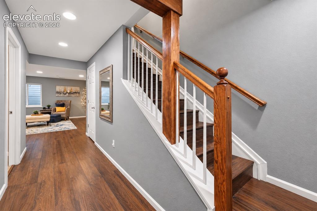 Image 44 of 50: A cohesive palette and warm flooring carry naturally throughout the home.