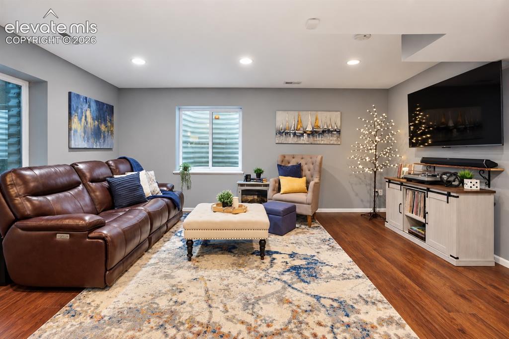 Image 45 of 50: A comfortable second family room adds valuable space for movie nights, game
