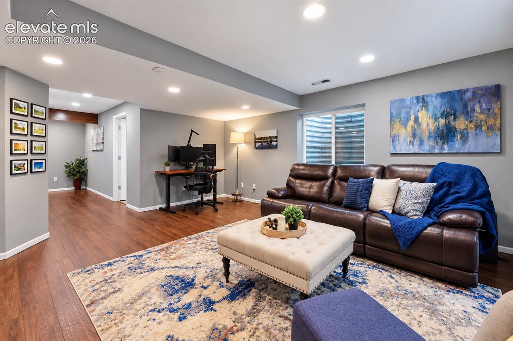 Image 46 of 50: The lower-level family room connects easily to the hallway and full bath, c