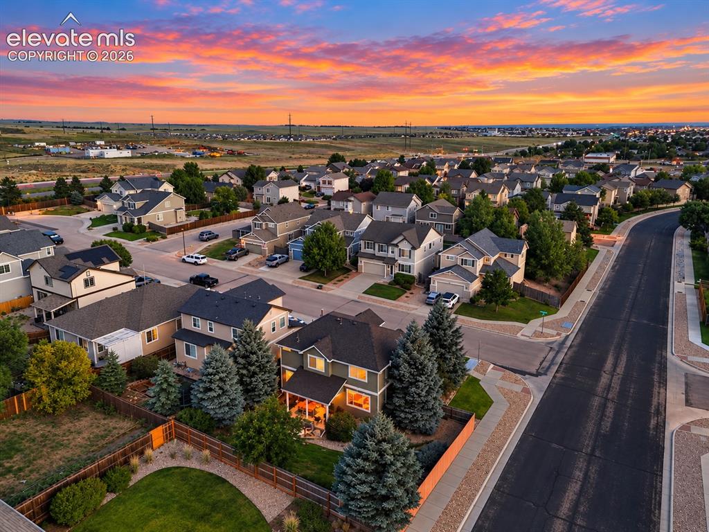 Image 49 of 50: An elevated view showcases the beautifully maintained backyard and desirabl