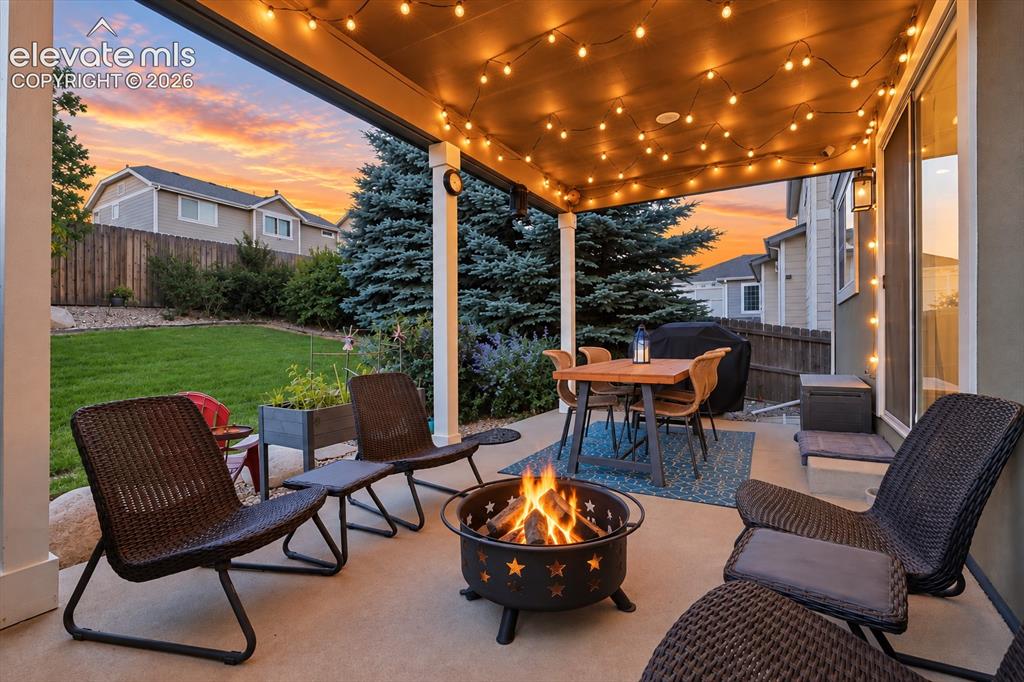 Image 5 of 50: Covered outdoor living extends the home outside for dinners, conversations 