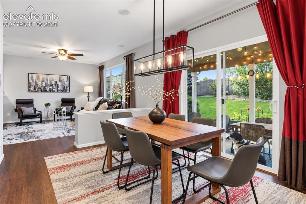 Image 8 of 50: Dining flows naturally toward the backyard, bringing indoor and outdoor liv