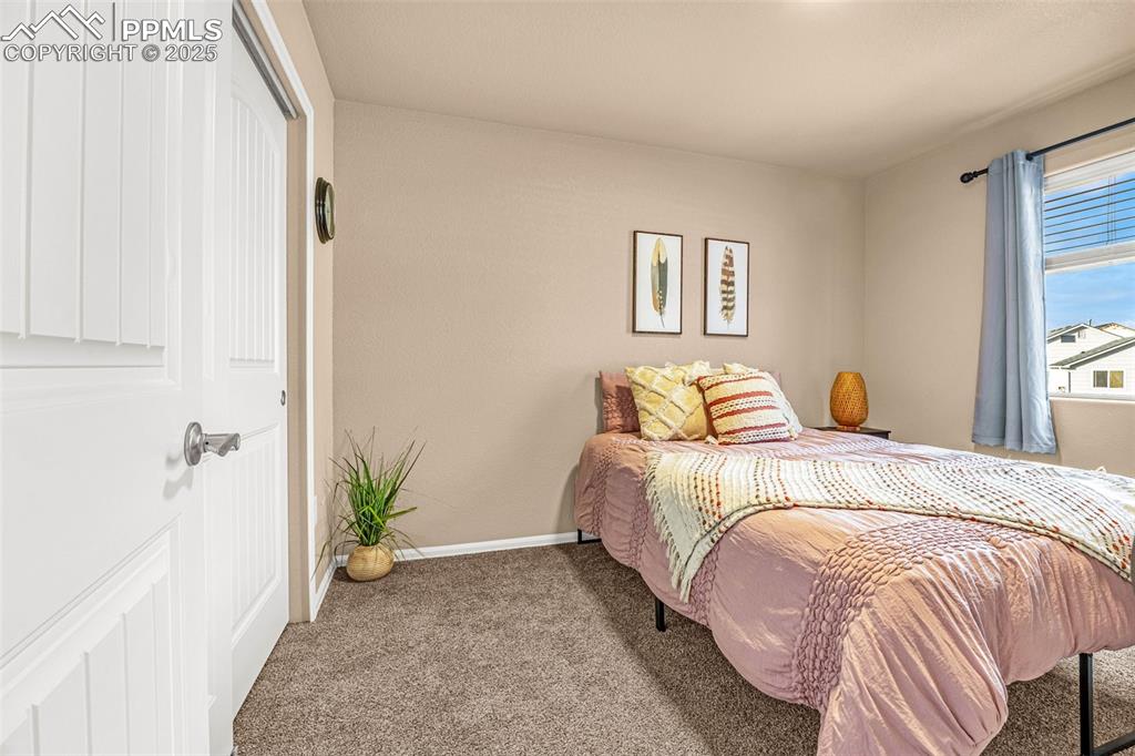 Image 23 of 34: Carpeted bedroom featuring baseboards