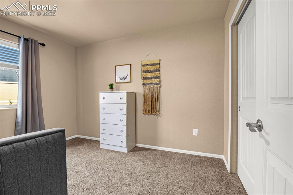 Image 24 of 34: Carpeted bedroom featuring baseboards