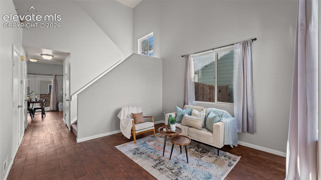 Image 5 of 26: Vaulted ceilings complement the neutral wall tones and wood-finish flooring