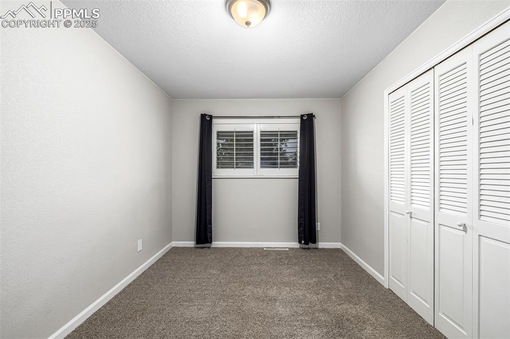 Image 16 of 42: Lower level bedroom