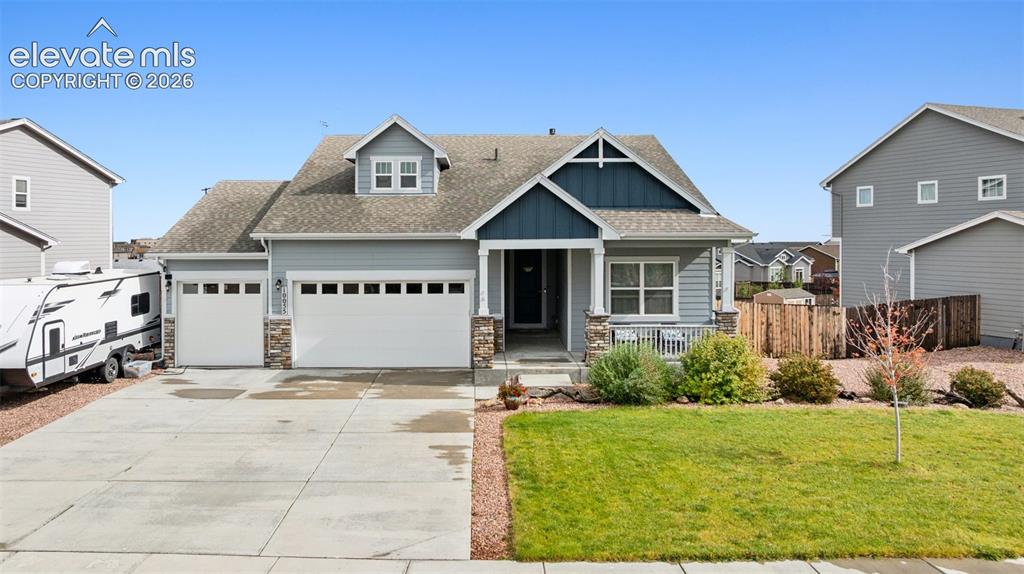 Caption: Craftsman inspired home featuring roof with shingles, board and batten siding, covered porch, concre