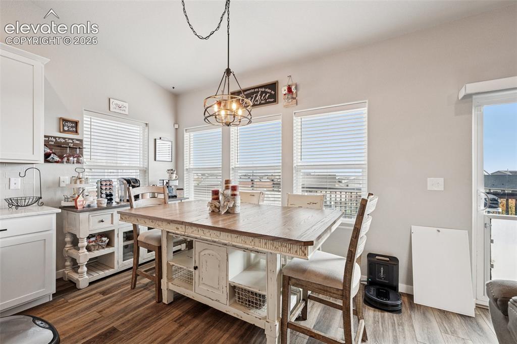 Image 11 of 40: Dining area with attention to detail in the lighting and great views of the