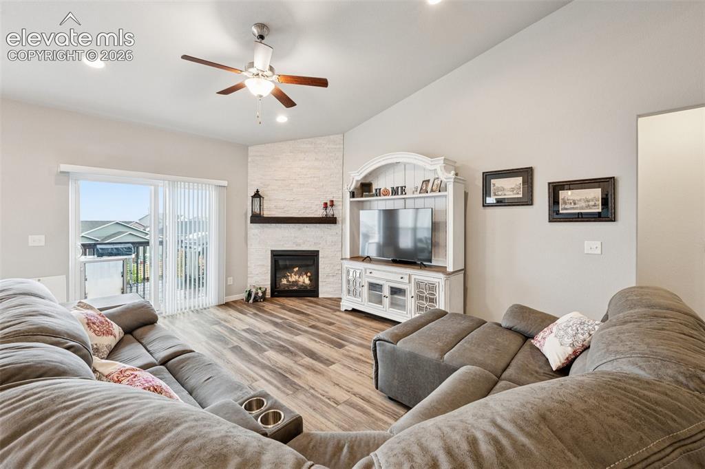 Image 12 of 40: Living room is cozy.  Homeowners loves the easy care flooring throughout th