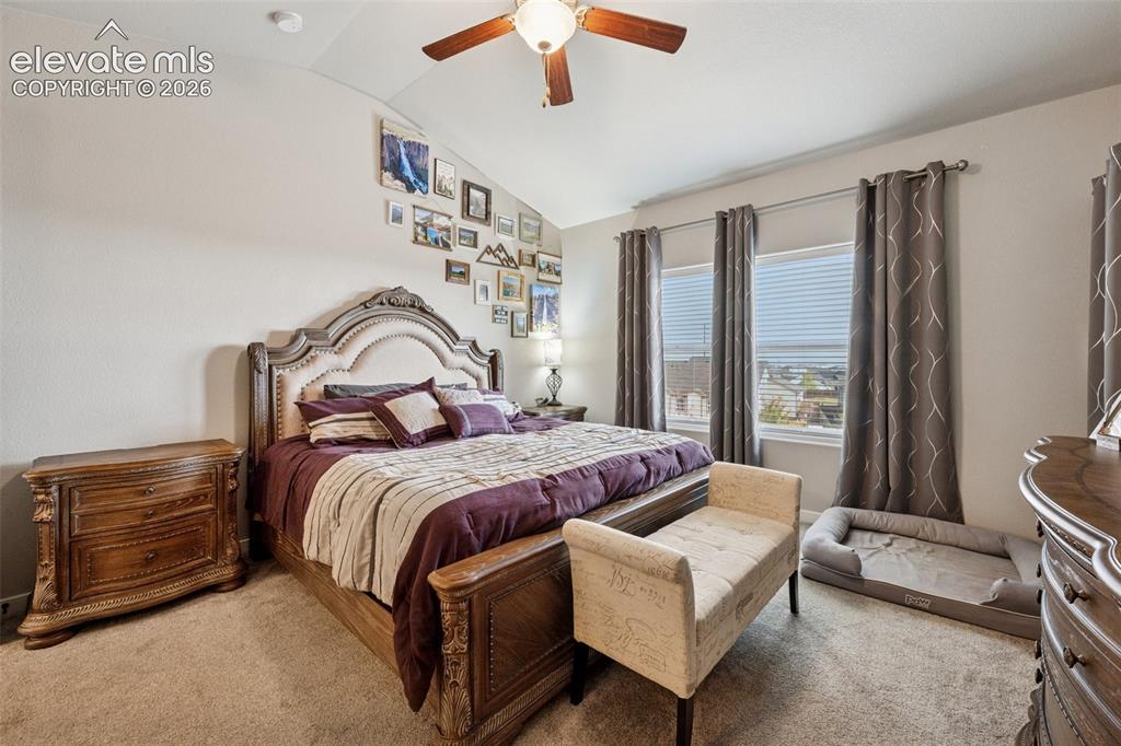 Image 16 of 40: Large primary suite with ceiling fan and great views. Main floor location.