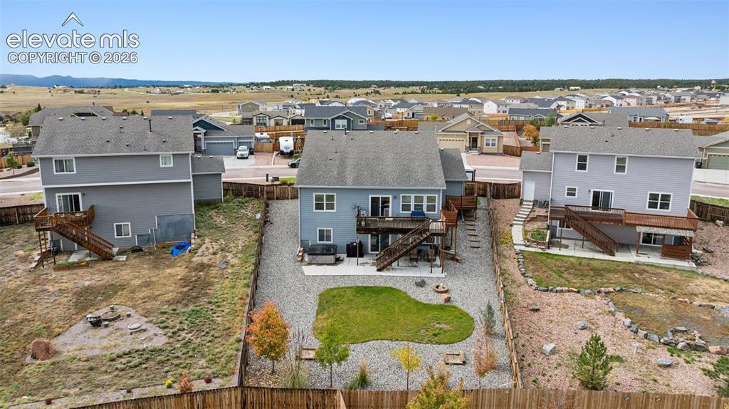 Image 6 of 40: Aerial perspective of quiet suburban area as shown from the rear of the hom