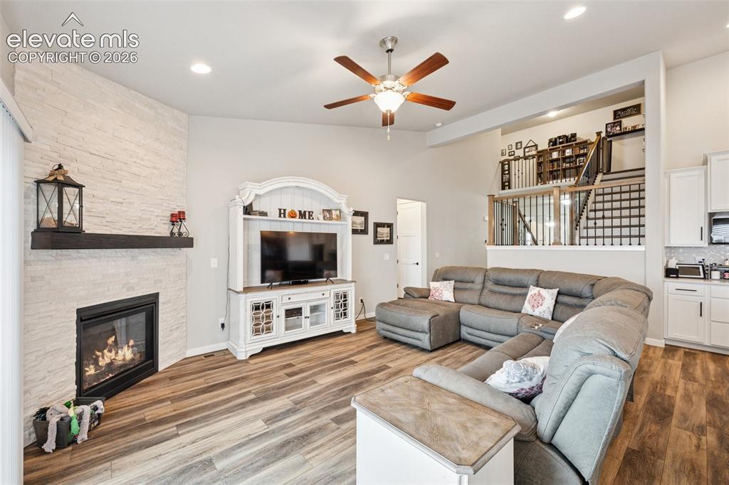 Image 7 of 40: Living room featuring fireplace and great room feel. Open, light and bright