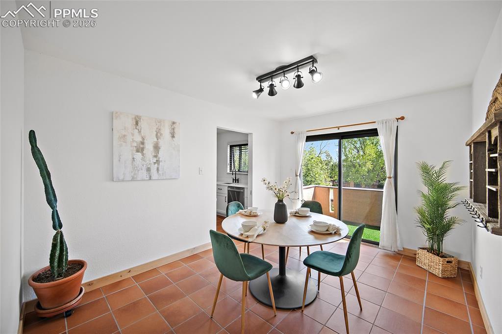 Image 11 of 41: Large dining area with walk-out to the balcony.