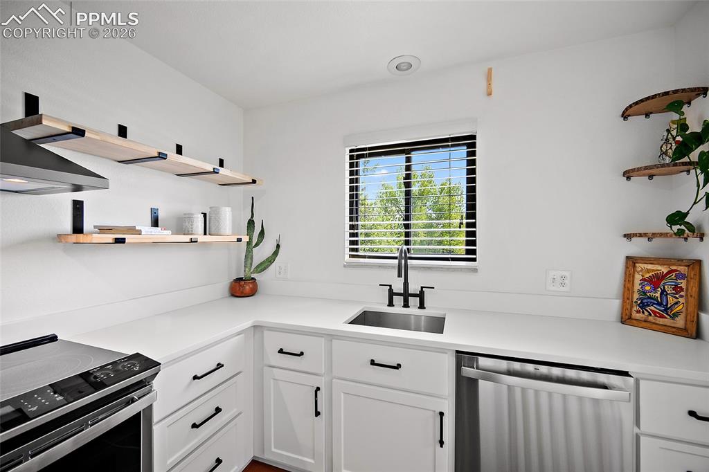 Image 14 of 41: Floating shelves give a look of elegance.