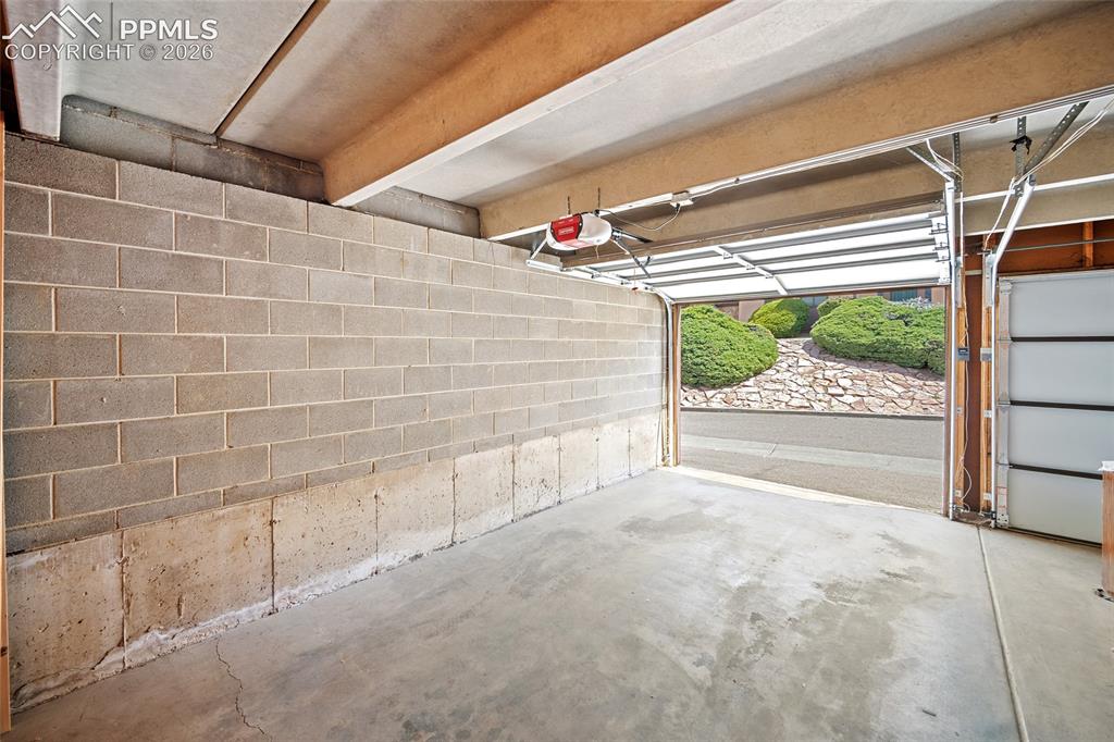 Image 29 of 41: 1 car garage with storage.