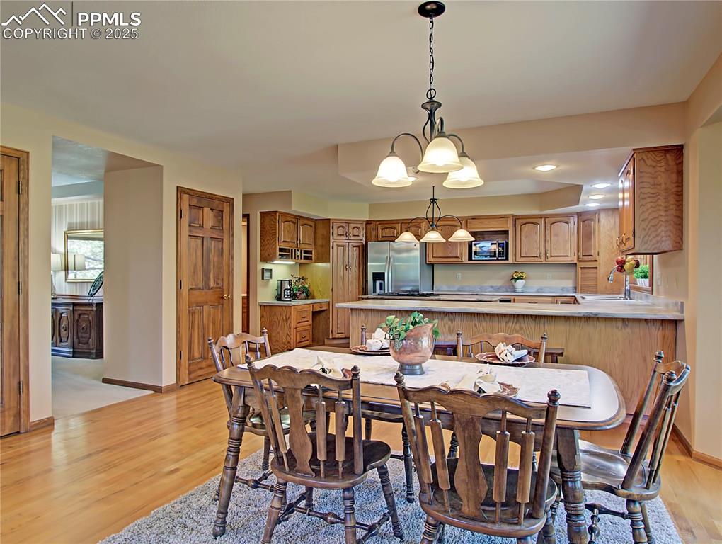 Image 10 of 40: View of kitchen from great room. 