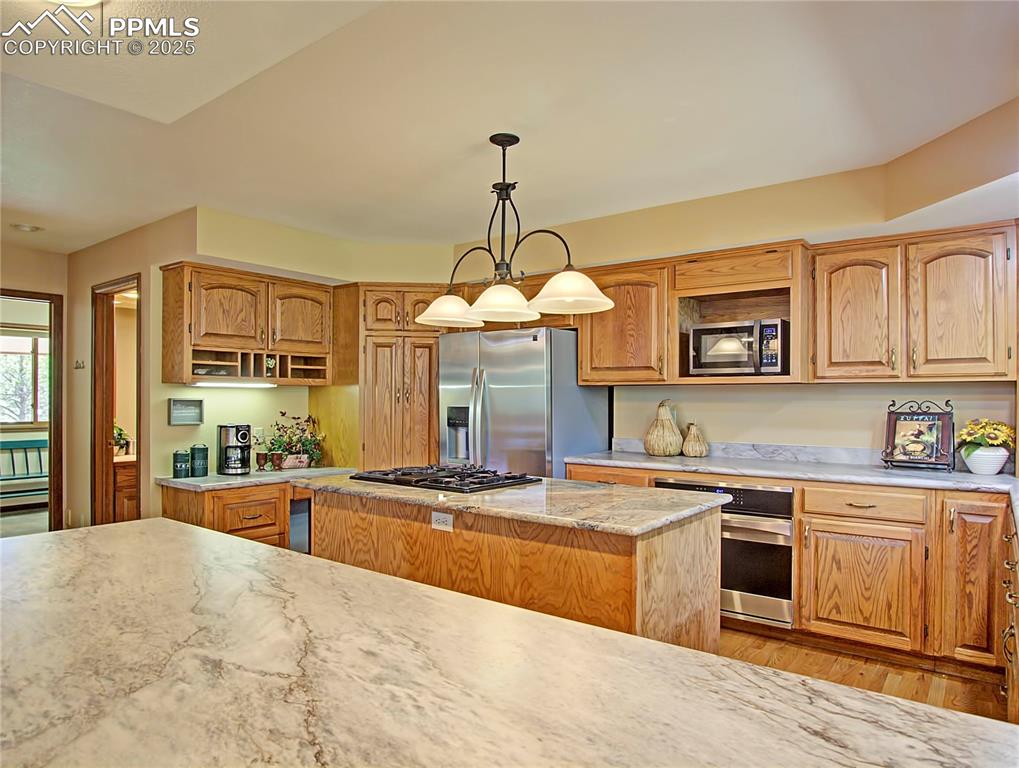 Image 11 of 40: Lots of countertop space for food prep or making holiday cookies with the f