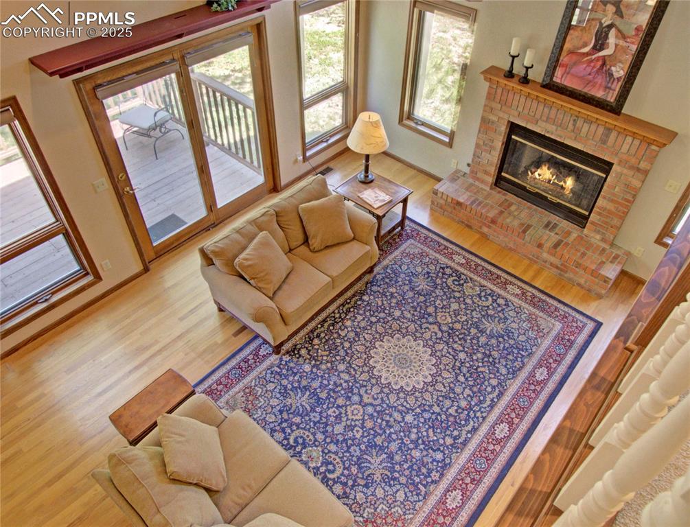 Image 21 of 40: View of great room from the upstairs walkway looking down.