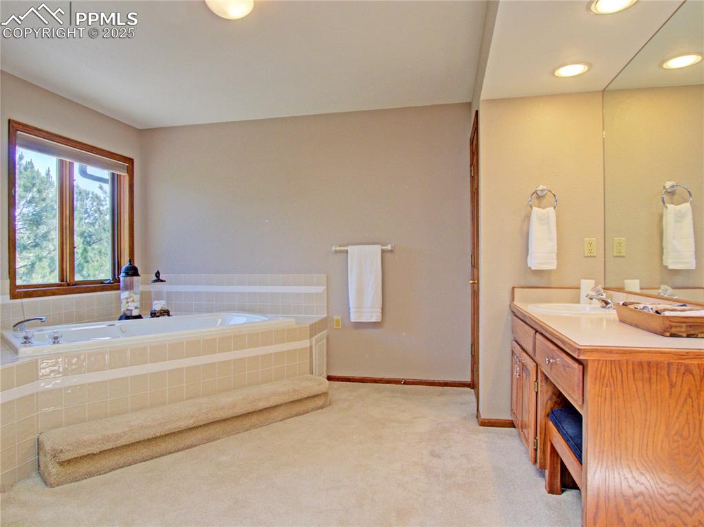 Image 26 of 40: Relaxing jetted soaking tub ...linen closet on the right of the towel bar.