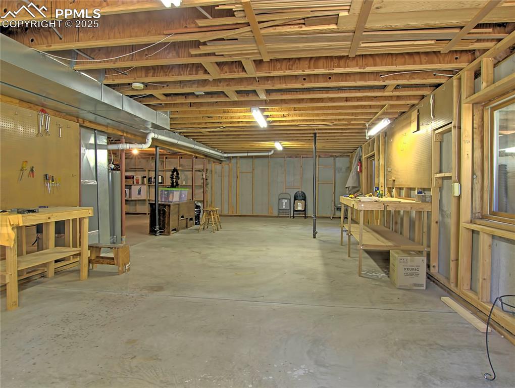 Image 34 of 40: Another view of the basement ...space to play inside during the winter ridi