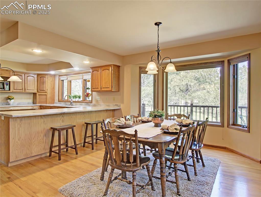 Image 9 of 40: The breakfast bar provides additional seating options.