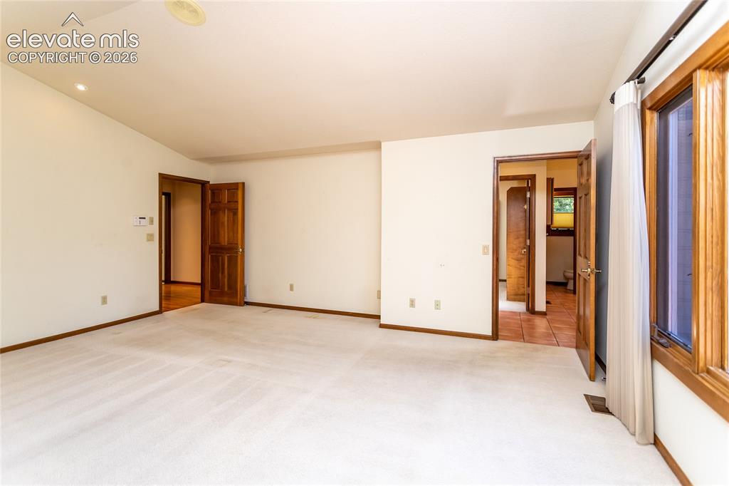 Image 14 of 40: second bedroom with carpet