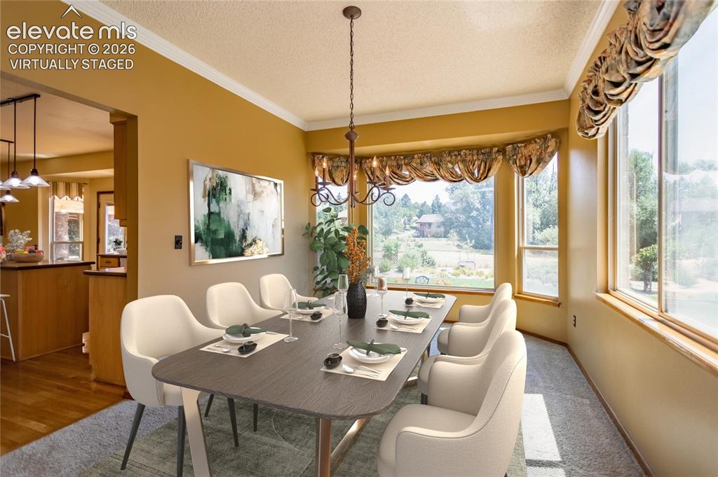 Image 11 of 50: Virtually Staged: Light and Bright formal Dining Room has a Bay Window and