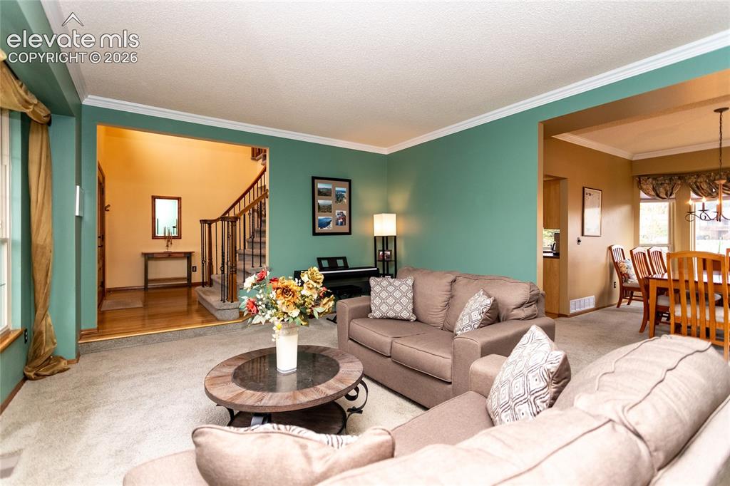 Image 15 of 50: Formal Living Room sits between the Dining Room and the Entry Foyer