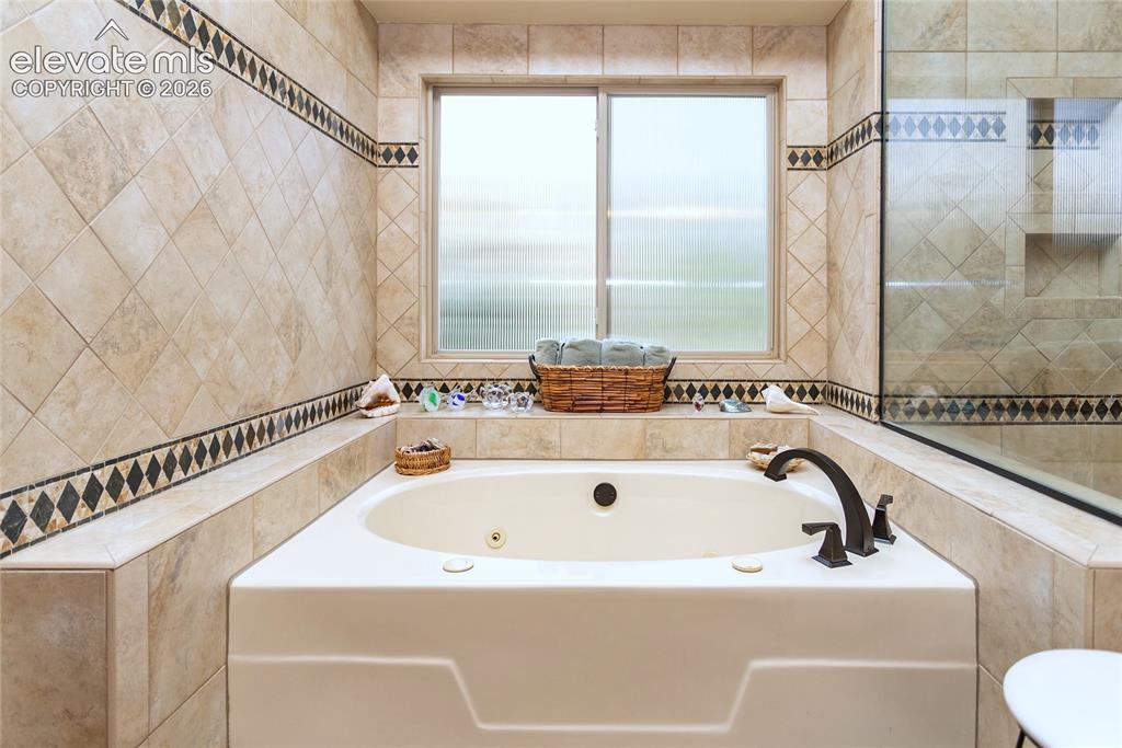 Image 22 of 50: Primary Bathroom Suite Jetted Tub