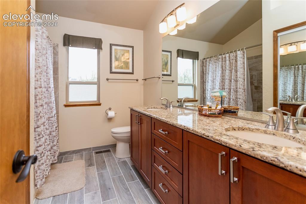Image 29 of 50: Full Upper Level Bathroom w/ Granite Countertops