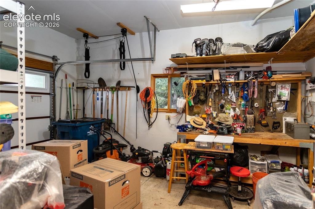 Image 39 of 50: Third Garage Bay is currently a Workshop