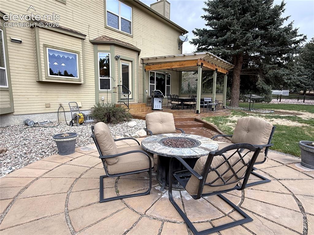 Image 42 of 50: Gorgeous Firepit Area (Firepit and Chairs Included)
