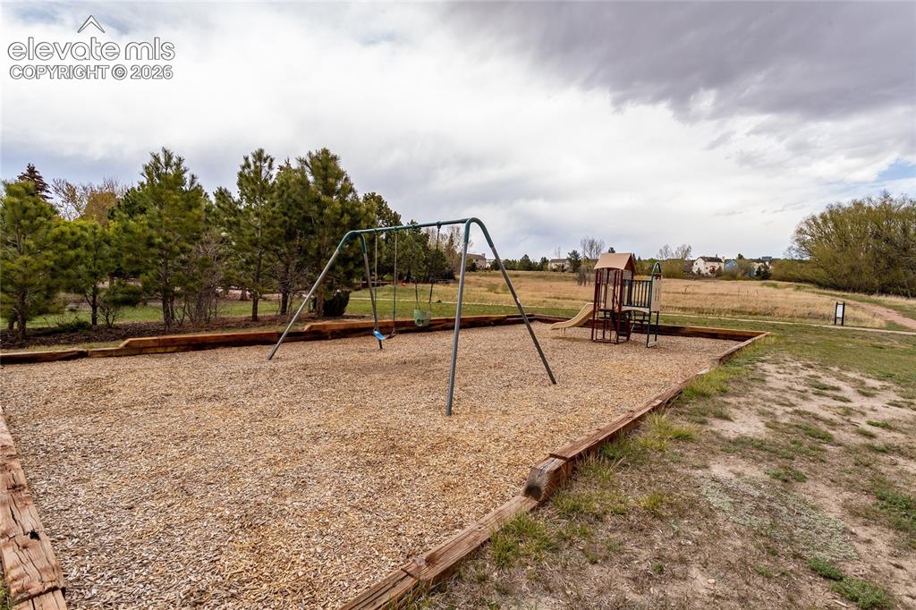 Image 47 of 50: Toddler Playground is behind Property in Open Space