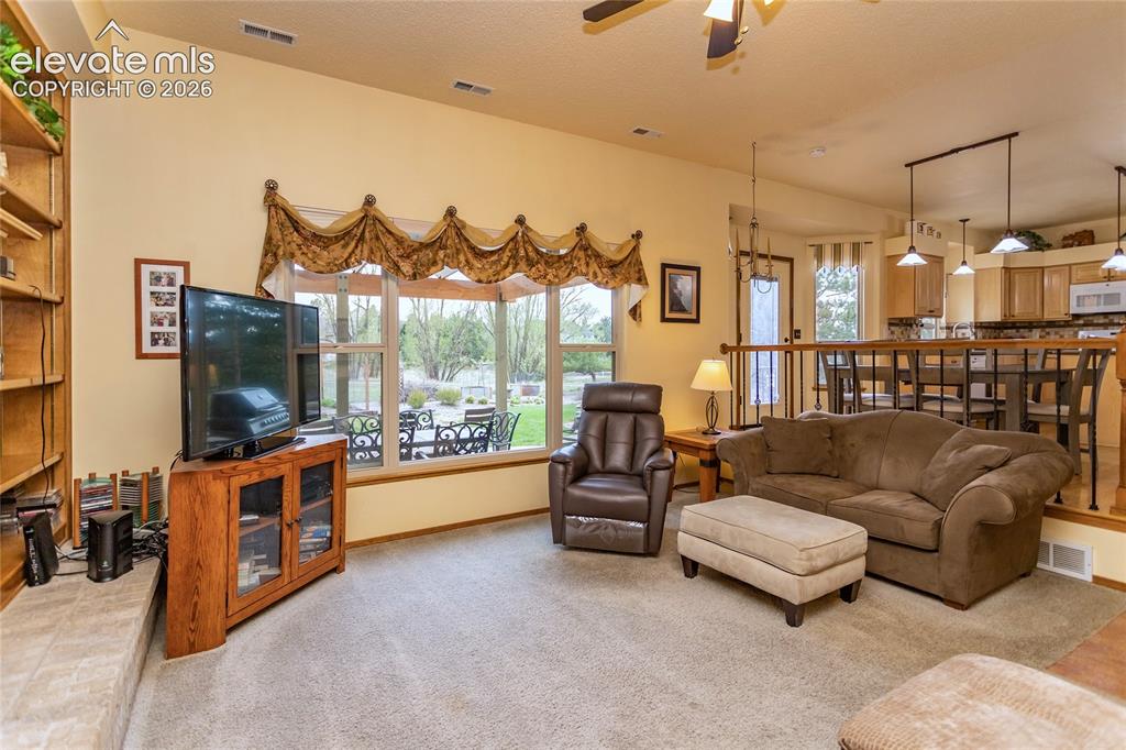 Image 6 of 50: Family Room Overlooks the Patio and Kitchen