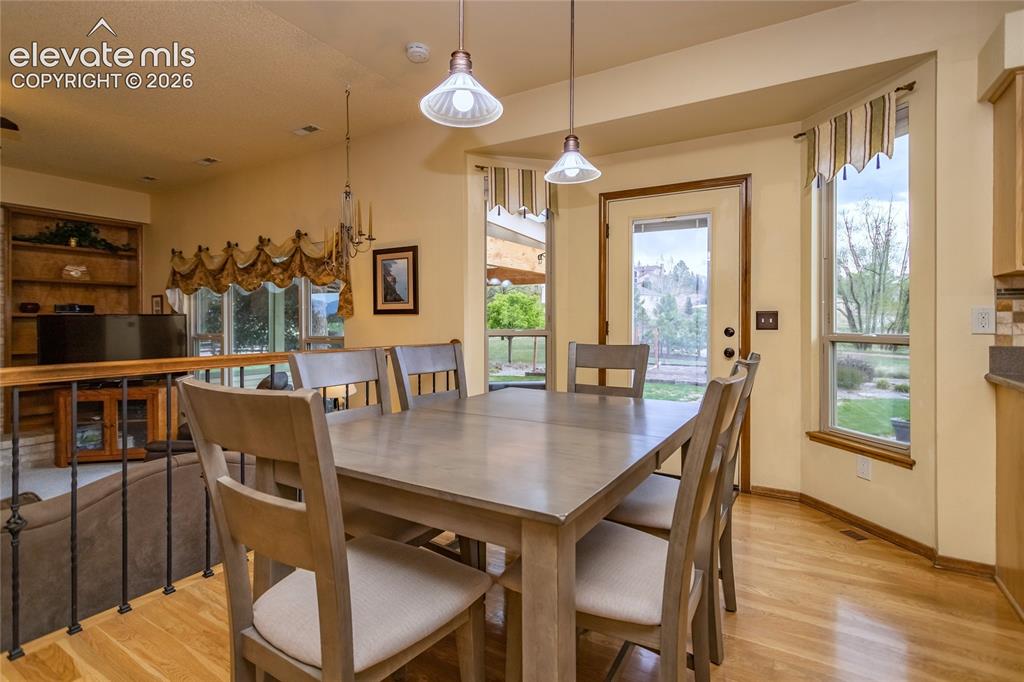 Image 8 of 50: Kitchen Nook has Bay Window/ Door and walks-out to the Patio