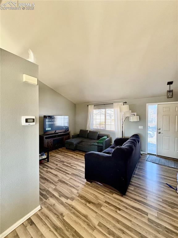 Image 3 of 11: Main level living area that opens to front yard