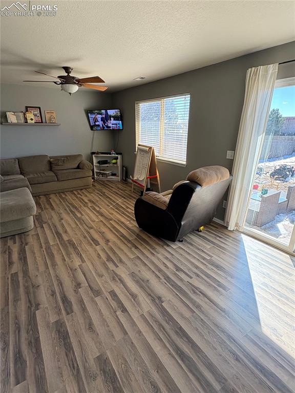 Image 4 of 11: Main level walks out to backyard with LVP flooring