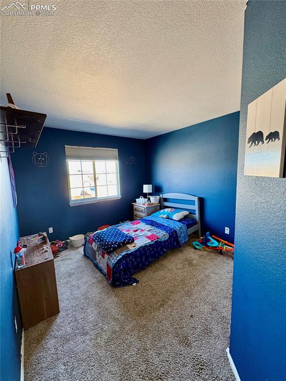 Image 7 of 11: Upper level bedroom