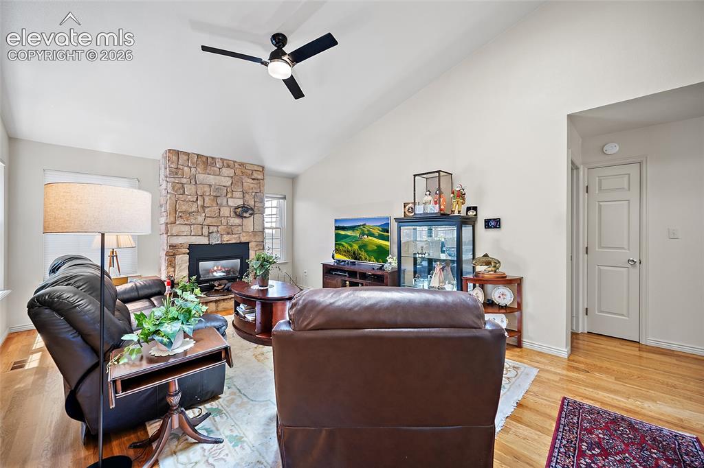 Image 10 of 45: High Ceiling and Gas fireplace and REAL woodfloors.