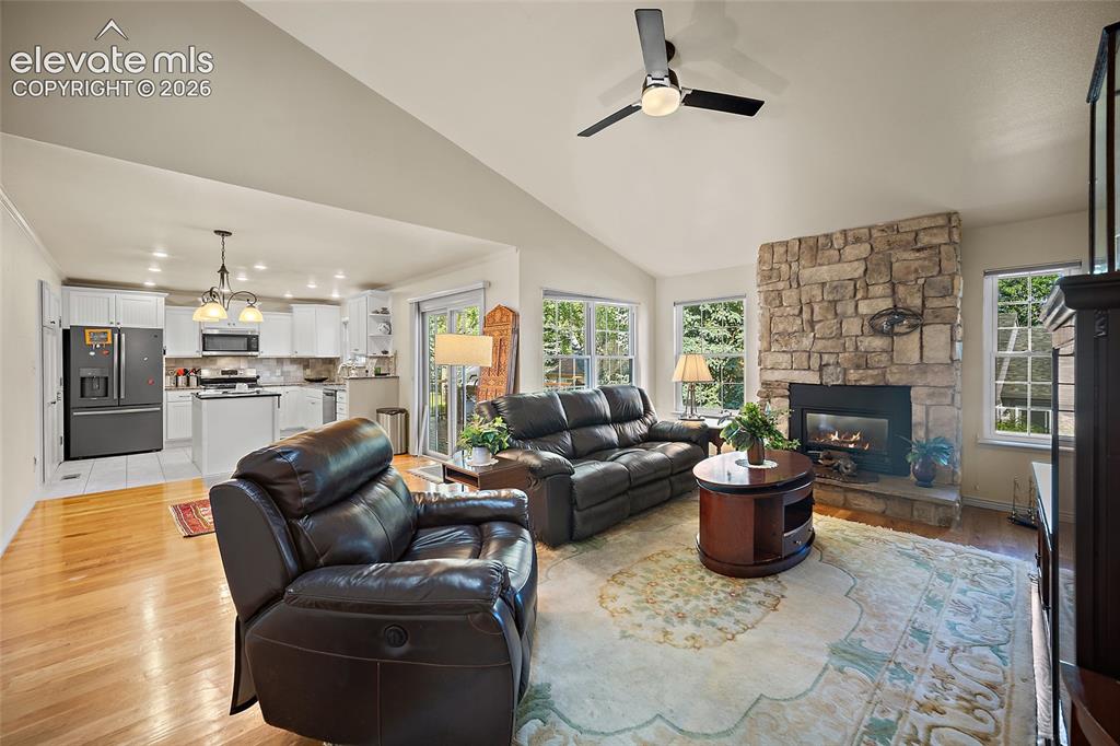 Image 10 of 48: High Ceiling and Gas fireplace and REAL woodfloors.