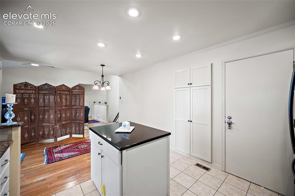 Image 17 of 48: Open floor plan just remove the divider.