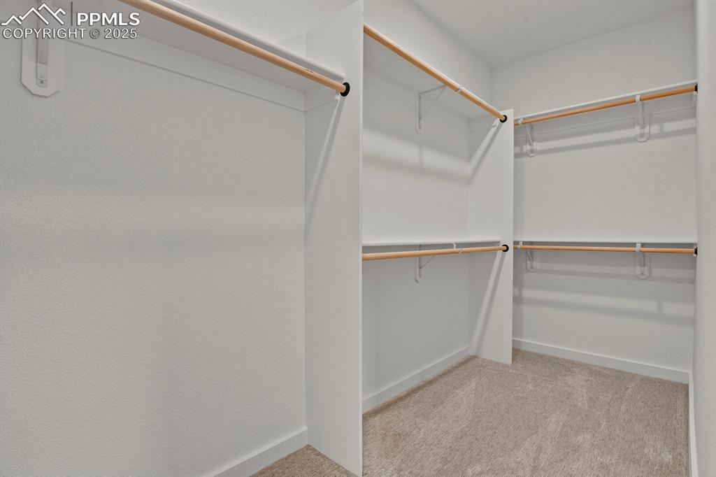 Image 13 of 49: Walk-in Closet