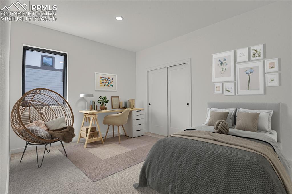 Image 14 of 49: Main level bedroom. Virtually Staged