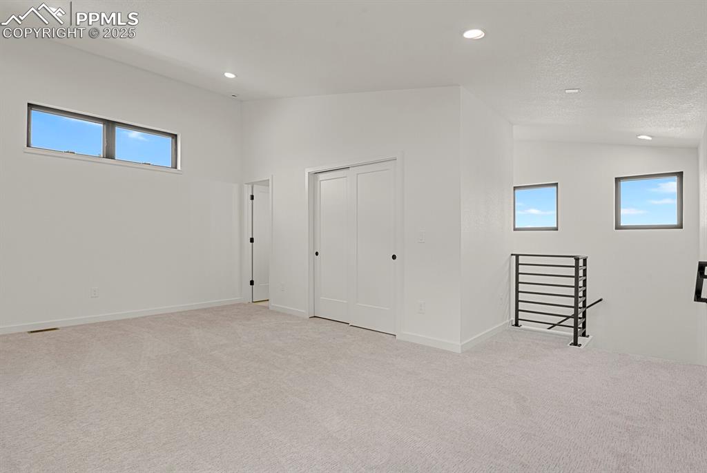 Image 23 of 49: Upper level loft/secondary suite