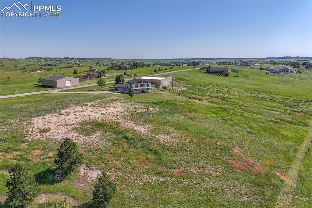 Image 32 of 38: Overview of rural landscape featuring a pastoral area